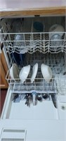 Dishes, glasses, and silverware in dishwasher