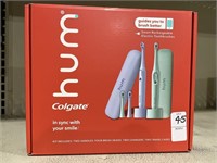 COLGATE HUM 2 HANDLES 4 BRUSH HEADS 2 CHARGERS