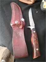 Hunting knife in leather sheath