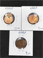 Three error Lincoln Cent coins. All off center