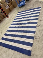 Used 9x6 blue and white striped woven rug. Looks