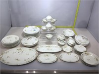 Limoges serving set. Platters, plates, cups and