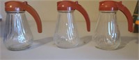 Vintage syrup dispensers. Each is 6"