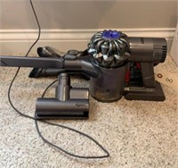 DYSON HAND HELD VACUUM WITH ACCESSORIES