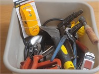 Plastic tub of miscellaneous tools and strapping