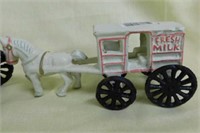 Set of 3 cast iron horse and wagon figurines,