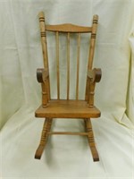 Wooden rocking doll chair with arms and spindle