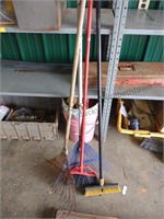 Lawn rake and a scrubber and a small room