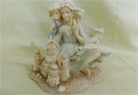 Two angel figurines - 1 grandmother figurine,