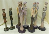 8 thin dressed animal figurines, tallest is 12.5"