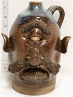 Brown/blue cyclops face jug w/ mustache