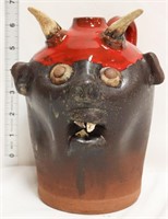 Dark brown/red face jug w/ devil horns & 3 teeth