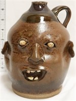 Brown face jug w/ 5 teeth & small eyes