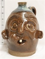 Brown/blue face jug w/ 1 tooth
