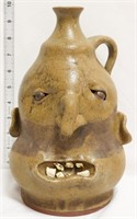 Tan face jug w/ brown stripe around middle of face