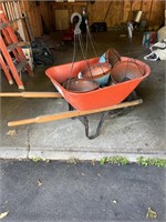 Wheelbarrow with Potting soil and pots