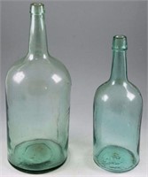 Lot #4315 - (2) vintage glass water bottles