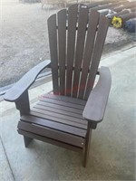 Brown Adirondack chair has some damage