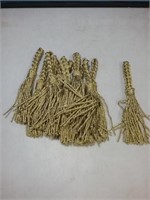 Set of 12 gold tassels could be used as napkin