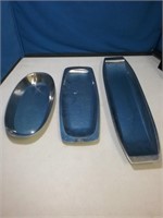 Group of three modern stainless steel trays