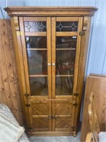 Solid oak leaded glass corner curio cabinet