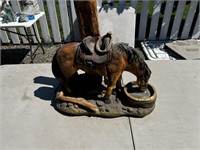 Horse drinking from trough statue