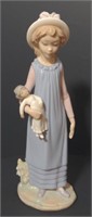 Lladro Porcelain Figure "Girl with a doll".