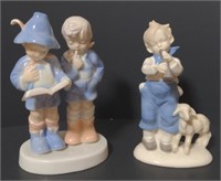 Porcelain Figures of children reading and a child