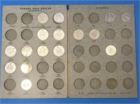 50c Coins in Book - Silver