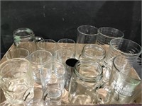 Assortment of drinking glasses and shot glasses.