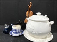 Miscellaneous decor items and a soup tureen.