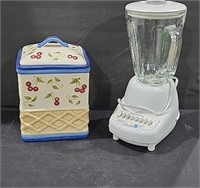A Glass Cookie Jar 7"×10" with lid and a Proctor