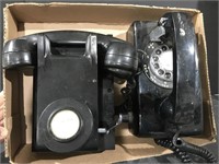 A pair of Vintage wall phones. No dial tone