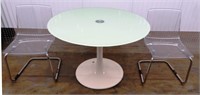 A Kinetic Round Table and Two Acrylic Chairs