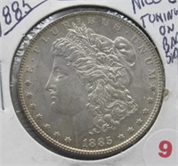 1885 Morgan Silver Dollar. Nice/Toning on Back