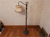 Antique floor lamp. Shade is torn. 55ins tall.