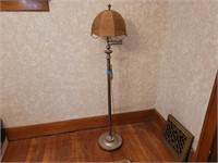 Vintage floor lamp with jute wrapped shade.