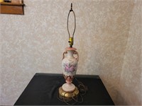 Ceramic table lamp with flower design. No shade.