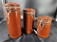 Clay pottery canister set. 10", 8½" & 6½".