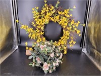 Artificial flower arrangement and wreath.