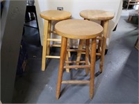 Wooden stools. Similar design.  All 24in seats