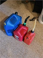 Three plastic kerosene and gasoline cans