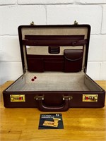 Vintage footed leather brief case w code card