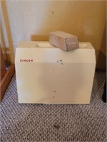 Vintage Singer portable sewing machine with pedal