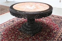 ORNATELY CARVED MARBLE TOP DINING TABLE