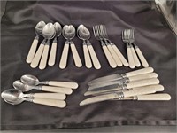 Plastic handle silverware. Not a complete set
