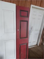 3 red painted 36x80 bi-fold door's