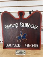 Vintage wood Bishop Builders advertising sign