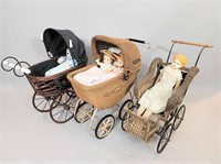 THREE DOLL CARRIAGES WITH DOLLS