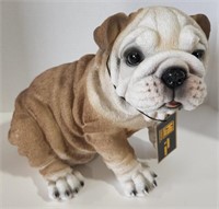 (CY) Resin dog statue.  Measures 12" long by 11"
